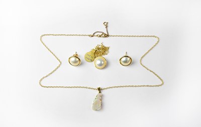 Lot 1169 - A 9ct gold pendant set with opal on an 18ct...