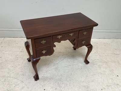 Lot 137 - A 19th mahogany five drawer writing table,...