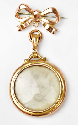 Lot 1120 - A 9ct rose gold brooch in the form of a bow,...