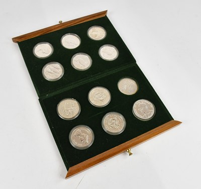 Lot 1174 - Twelve assorted silver commemorative coins, to...
