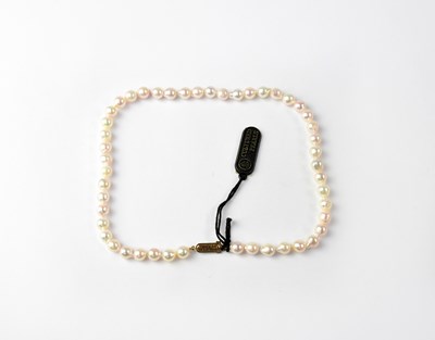 Lot 1183 - A pearl necklace with 9ct gold clasp, stamped...
