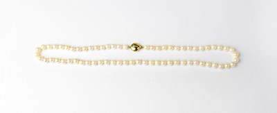 Lot 1184 - A pearl necklace with 9ct gold clasp, stamped...