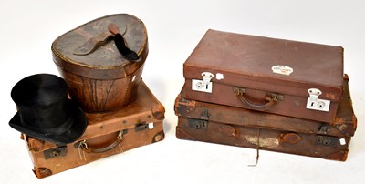 Lot 654 - A top hat in a fitted leather case, together...