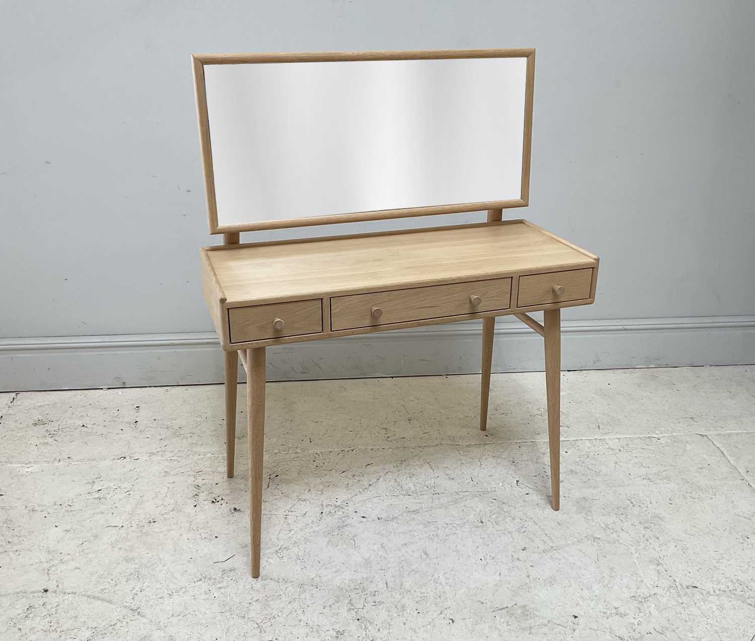Lot 3 - ERCOL; a 'Winslow' light oak dressing table,...