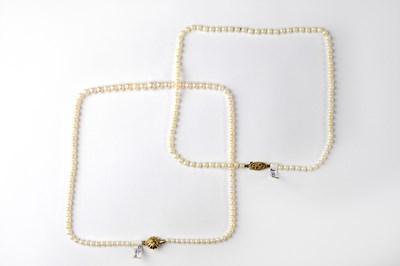 Lot 1189 - Two pearl necklaces with 9ct gold clasp,...