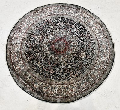 Lot 395 - A silk Caucasian circular grey ground rug,...