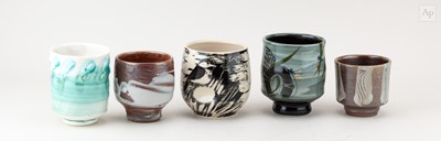 Lot 733 - A group of stoneware and porcelain yunomi by...