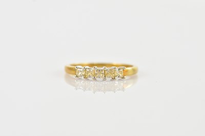 Lot 530 - An 18ct yellow gold dress ring set with five...