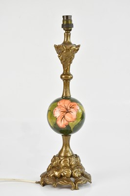 Lot 1566 - MOORCROFT; a 'Hibiscus' patern table lamp,...