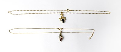 Lot 1170 - A 9ct gold pendant set with red stones and...