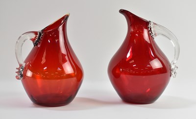 Lot 628 - WHITEFRIARS; two 1950s ruby red art glass jugs...