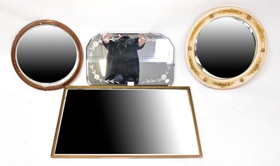 Lot 58 - A 1940s shaped bevelled wall mirror with acid...