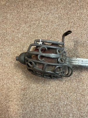 Lot 664 - A basket hilt broad sword, with shagreen grip,...