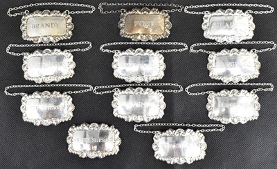 Lot 816 - A set of eleven silver plated spirit decanter...