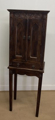 Lot 2819 - A teak narrow cupboard, the upper section...