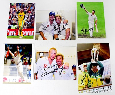 Lot 569 - SHANE WARNE; two signed colour photographs,...