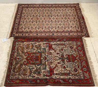 Lot 397 - A red ground Eastern style rug with geometric...