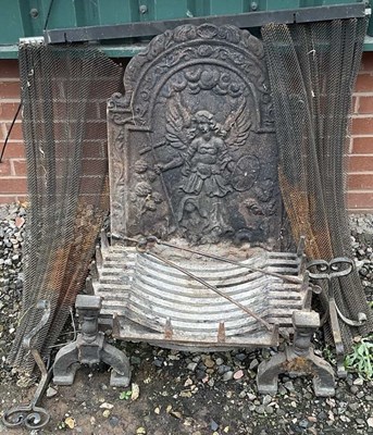 Lot 2750 - A large cast iron fire back, a fire curtain,...