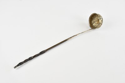 Lot 515 - A Georgian white metal toddy ladle, with...