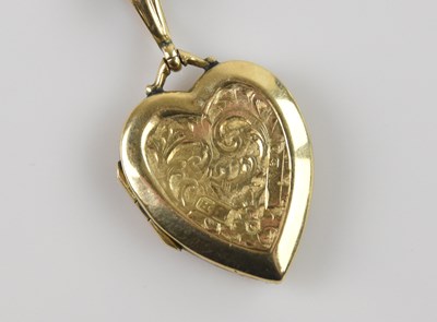 Lot 2081 - A 9ct yellow gold heart shaped pendant,...
