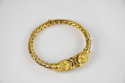 Lot 1097 - An Indian yellow metal and enamel hinged snap...