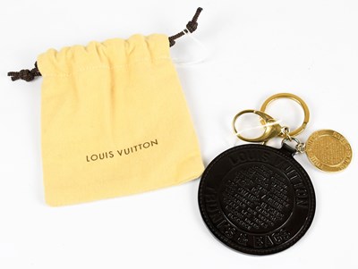 Lot 759 - LOUIS VUITTON; a black patent leather...