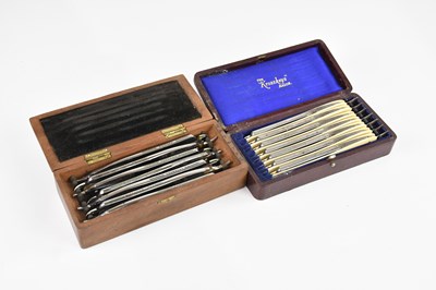 Lot 1133 - Two cased sets of cut throat razors, including...