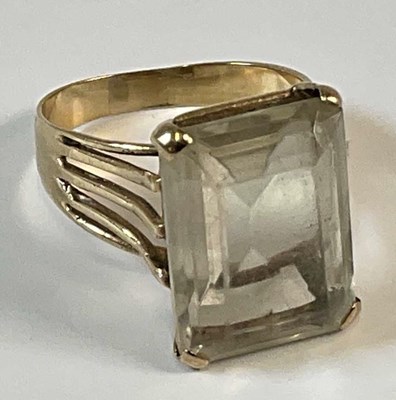 Lot 990 - A 9ct yellow gold dress ring with very pale...