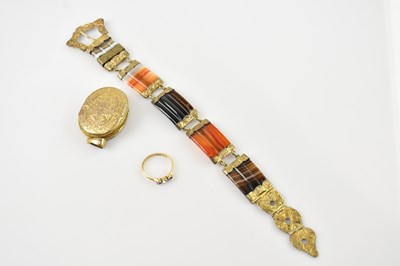 Lot 560 - A yellow metal dress ring set with a central...