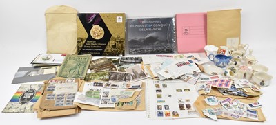Lot 448 - A mixed lot of stamps, postcards and crested...