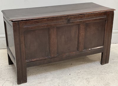 Lot 86 - An 18th century carved and panelled oak coffer,...