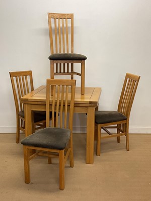 Lot 2837 - A modern light oak extending dining table,...