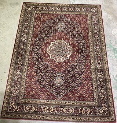 Lot 2745 - A machine woven rug in a distinctive Middle...