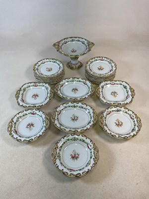 Lot 394 - A 19th century part dinner service decorated...