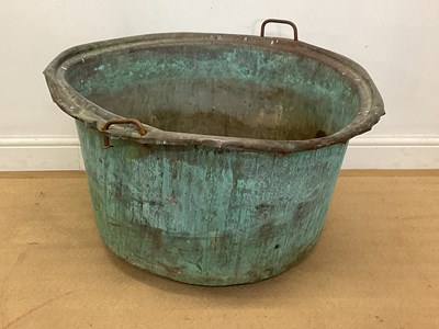 Lot 2748 - A large copper garden planter with metal drop...