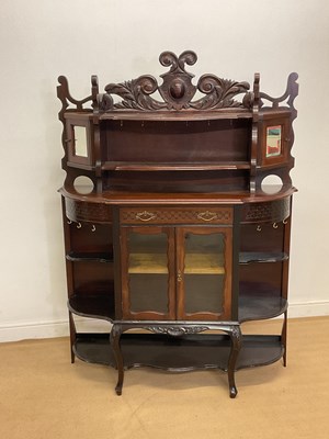 Lot 2838 - A mahogany cabinet with glazed doors below...
