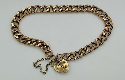 Lot 1035 - A 9ct rose gold curb link bracelet, with...