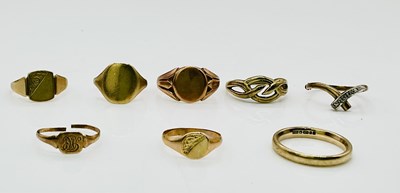 Lot 1036 - A 9ct yellow gold wedding band, size M, and...