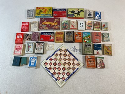 Lot 2007 - A collection of vintage playing cards and games.
