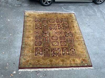 Lot 2159 - A hand knitted woollen yellow ground Eastern...