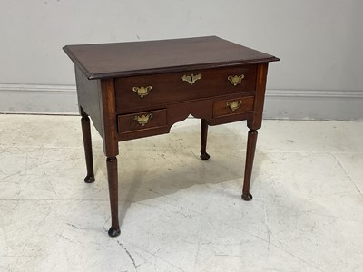 Lot 2015 - A 19th century oak lowboy with one long above...