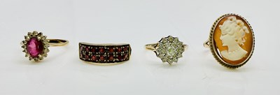 Lot 997 - Four 9ct yellow gold dress rings, including a...