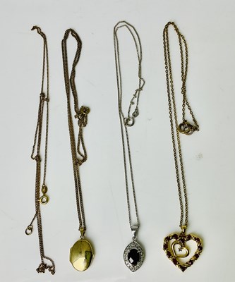 Lot 1001 - A group of 9ct and yellow metal pendants on...