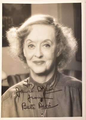 Lot 690 - BETTE DAVIS; a black and white photograph,...