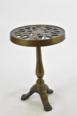 Lot 1186 - A gunmetal trivet, height 30cm.