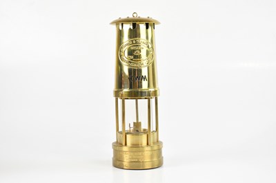 Lot 1092 - CAMBRIAN SAFETY LAMP MANUFACTORY; a brass...