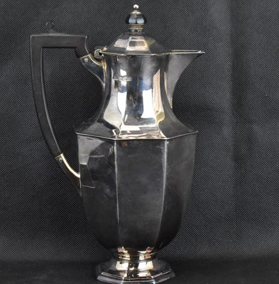 Lot 906 - A George V hallmarked silver hot water jug...