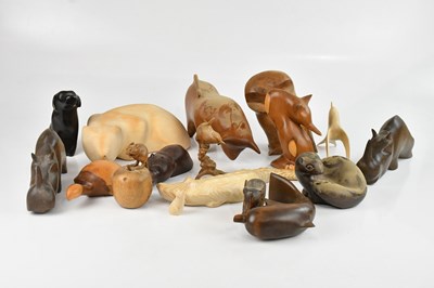 Lot 334 - A collection of modern wooden animals, largest...