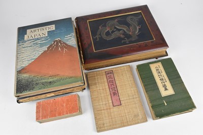 Lot 419 - An album of forty-three tinted photographs of...