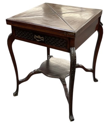 Lot 29 - An Edwardian mahogany two tiered single drawer...